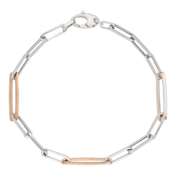Pulsera eslabón cruzado en oro dos tonos 14 kilates.
