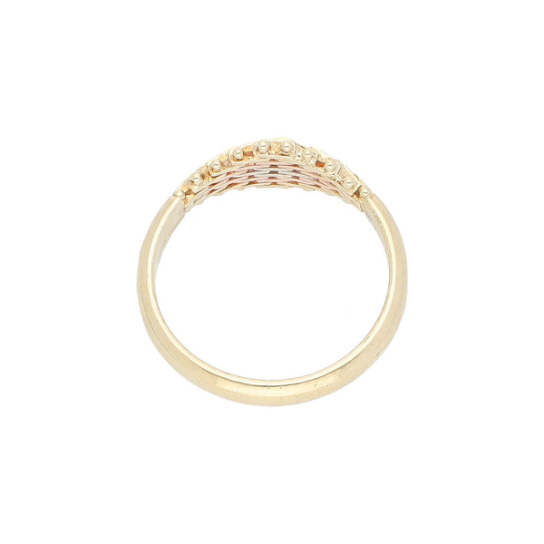Anillo boleado en oro tres tonos 14 kilates.