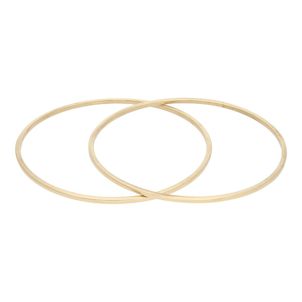 Dos pulseras de arillo lisas en oro amarillo 14 kilates.