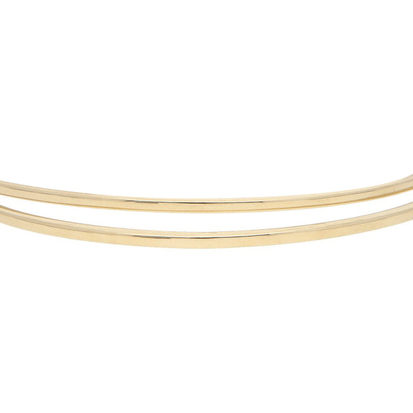 Dos pulseras de arillo lisas en oro amarillo 14 kilates.