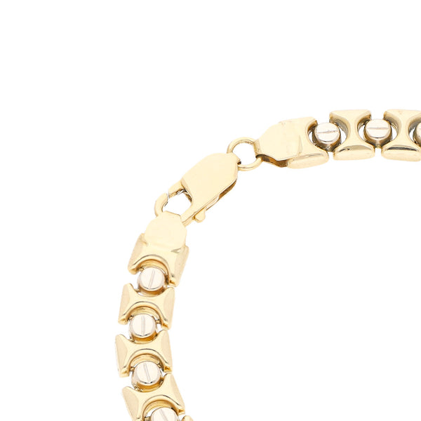 Pulsera eslabón articulado motivo tornillos simulados en oro amarillo 14 kilates.