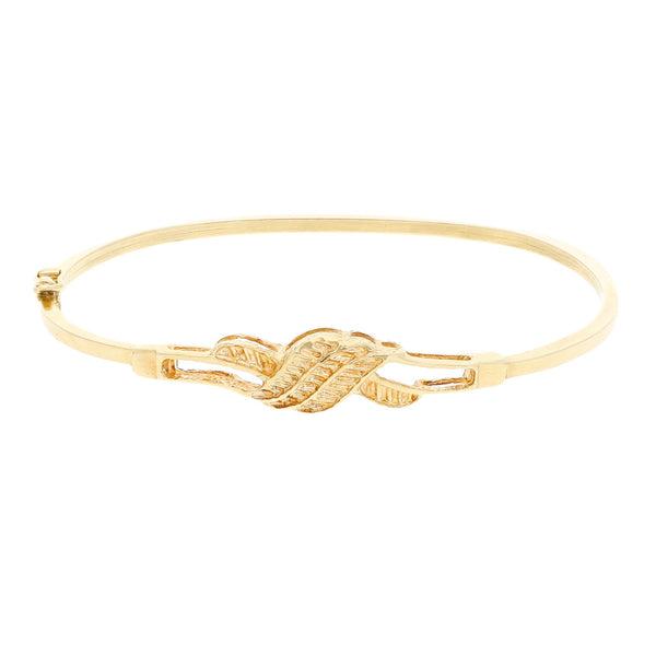 Pulsera de arillo hueca con aplicación en oro amarillo 14 kilates.