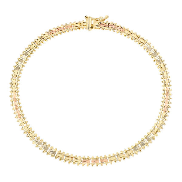 Pulsera eslabón boleado en oro tres tonos 14 kilates.