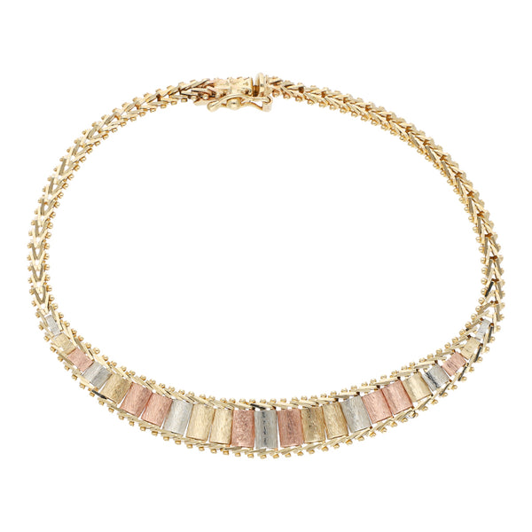 Pulsera eslabón boleado en oro tres tonos 14 kilates.