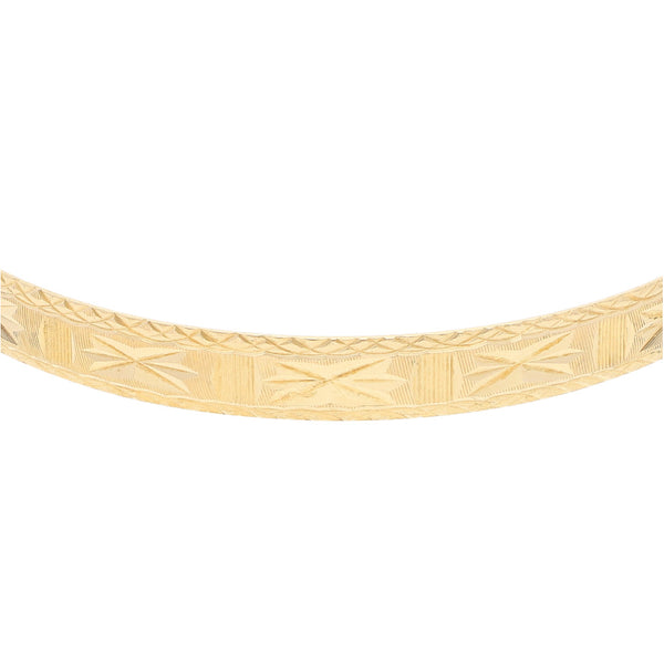 Pulsera de arillo labrada en oro amarillo 14 kilates.