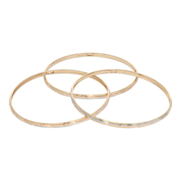 Tres pulseras de arillo labradas en oro amarillo 14 kilates.