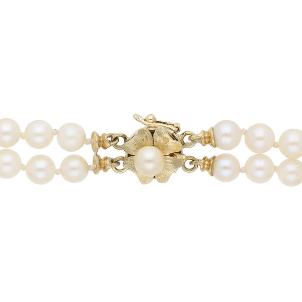 Pulsera eslabón articulado de perlas con aplicaciones de sintéticos en oro amarillo 14 kilates.
