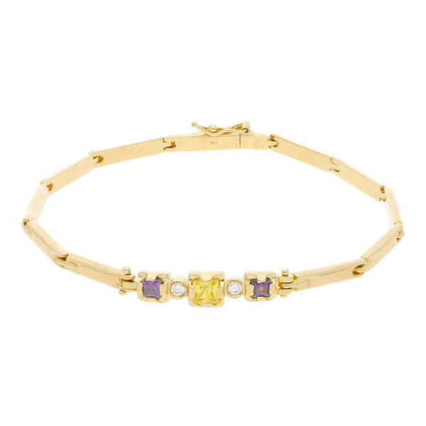 Pulsera eslabón articulado con aplicaciones de sintéticos en oro amarillo 14 kilates.