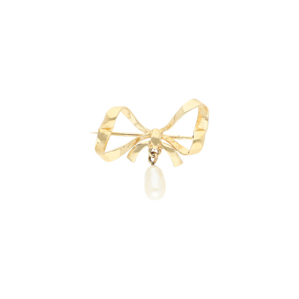 Prendedor diseño especial con perla motivo moño en oro amarillo 14 kilates.