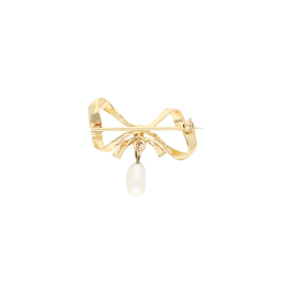 Prendedor diseño especial con perla motivo moño en oro amarillo 14 kilates.