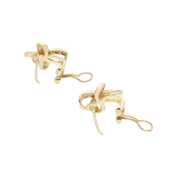 Juego de dije y aretes diseño especial con sintéticos en oro amarillo 12 kilates.