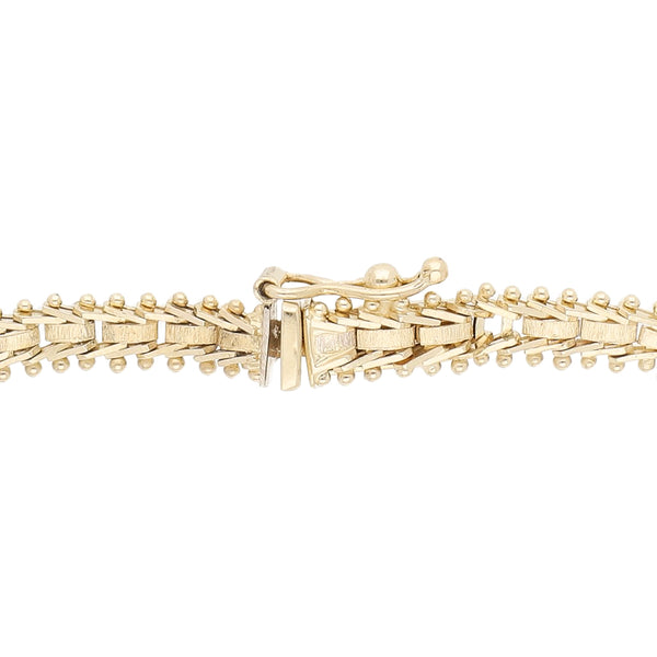 Pulsera eslabón boleado en oro tres tonos 14 kilates.