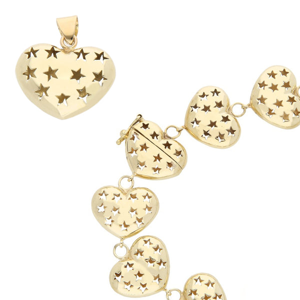 Juego de dije y pulsera calados motivo corazón en oro amarillo 14 kilates.