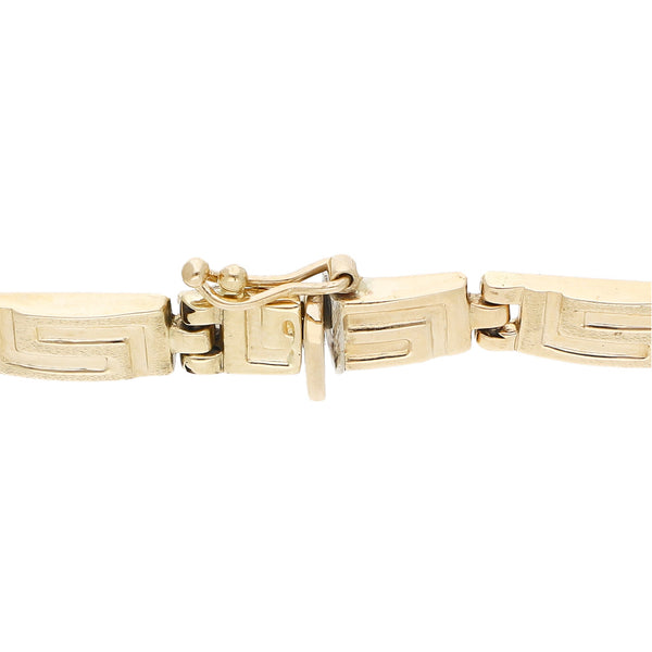Pulsera eslabón articulado motivo grecas en oro amarillo 14 kilates.