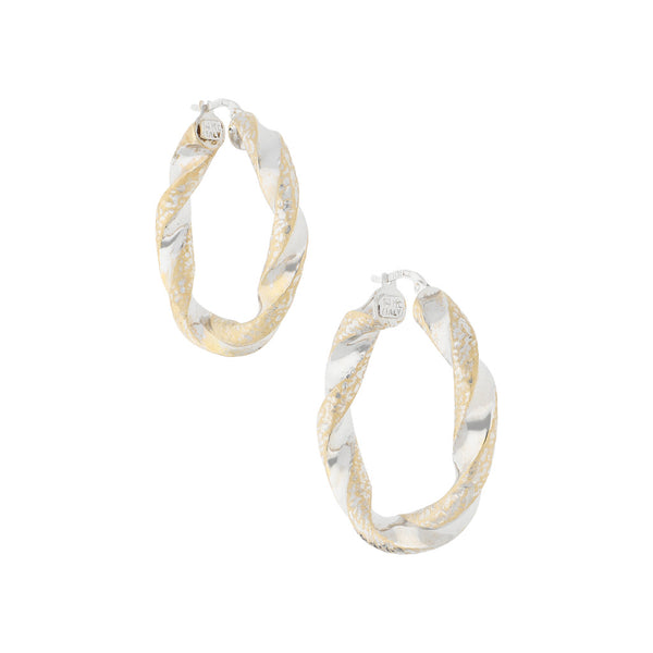 Arracadas torzal en oro blanco 14 kilates.