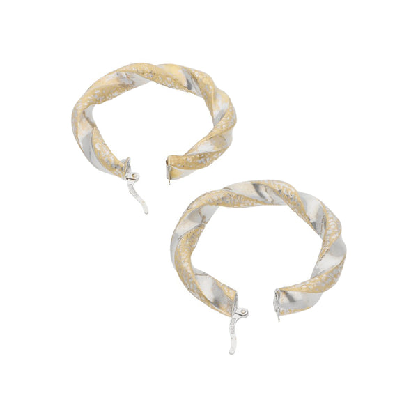 Arracadas torzal en oro blanco 14 kilates.