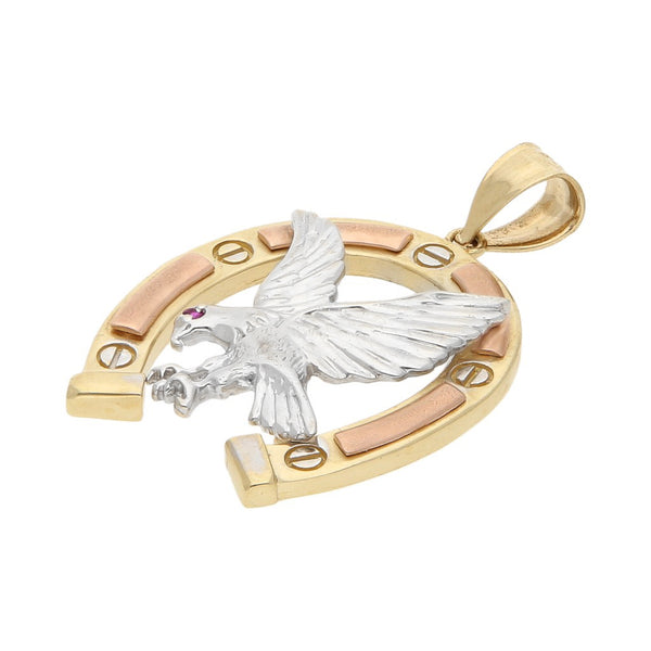 Dije diseño especial con sintético motivo águila en herradura en oro tres tonos 14 kilates.