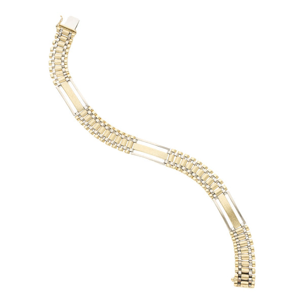 Pulsera eslabón articulado en oro dos tonos 14 kilates.