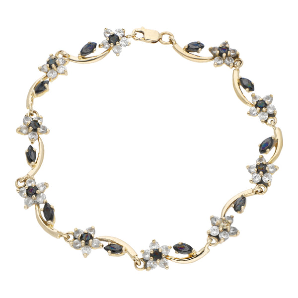 Pulsera eslabón articulado motivo flor con sintéticos en oro amarillo 12 kilates.