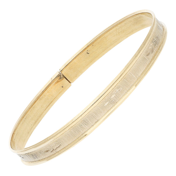 Pulsera de arillo labrada platinada en oro amarillo 14 kilates.