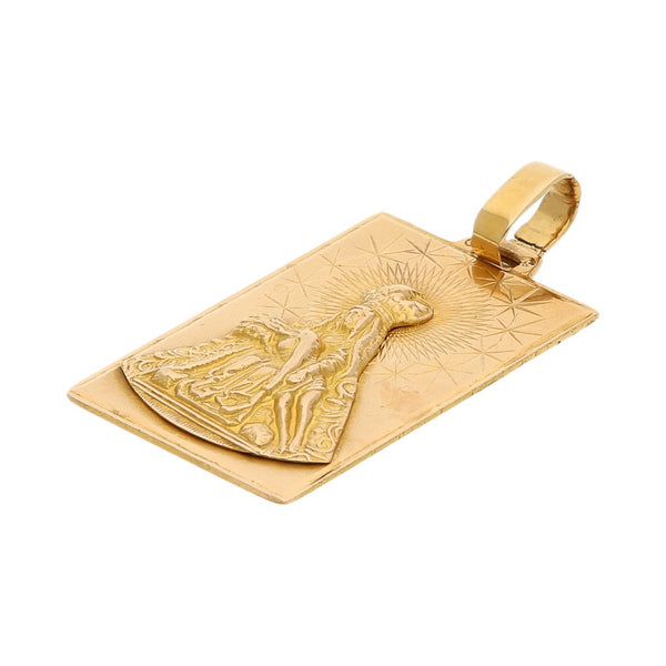 Medalla diseño especial motivo Virgen en oro amarillo 18 kilates.