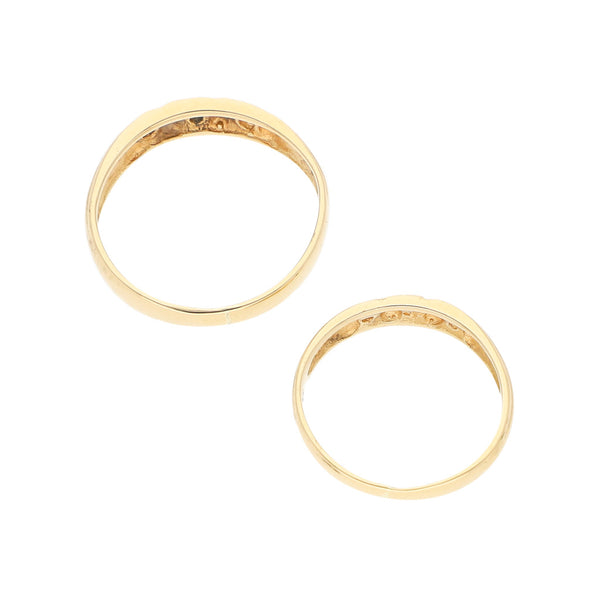 Dos argollas diseño especial con circonias en oro amarillo 14 kilates.