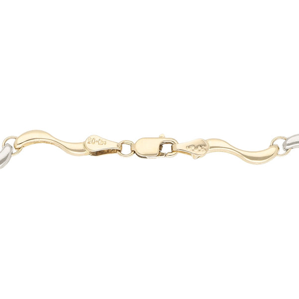 Pulsera eslabón articulado en oro tres tonos 14 kilates.