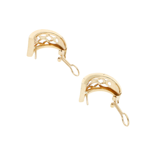Juego de anillo y aretes calados en oro amarillo 14 kilates.