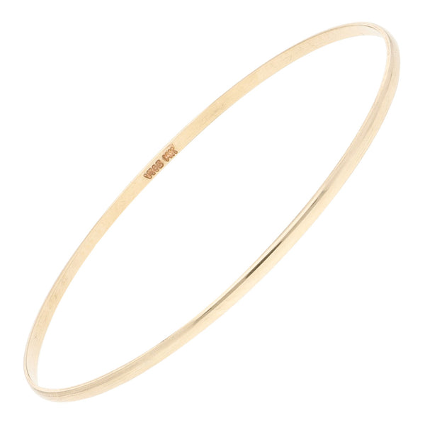 Pulsera de arillo lisa en oro amarillo 14 kilates.