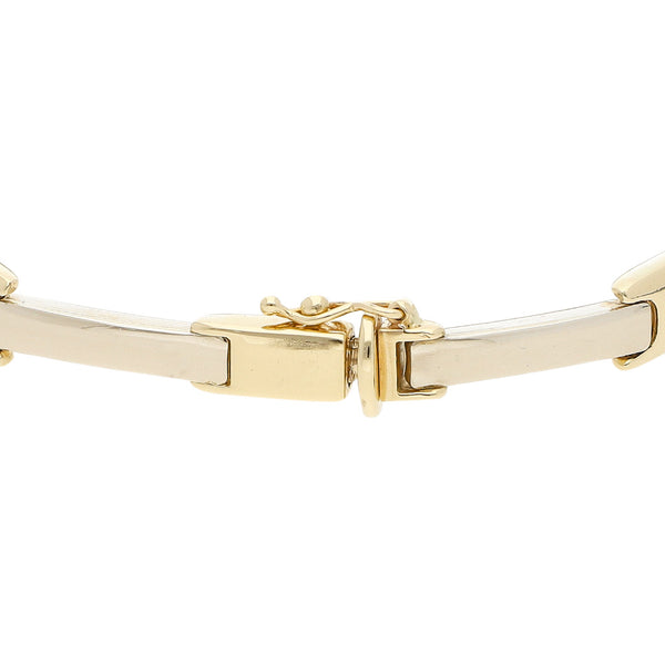 Pulsera eslabón articulado en oro dos tonos 14 kilates.