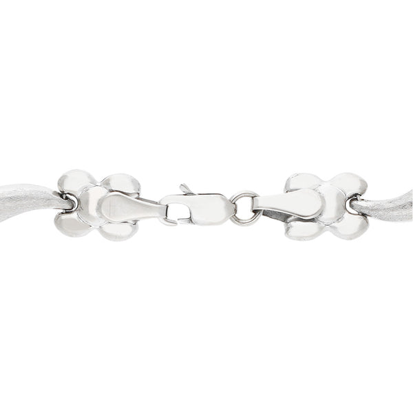Pulseras eslabón articulado motivo flor en oro blanco 14 kilates.
