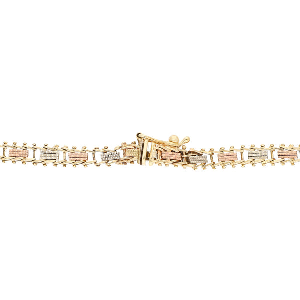 Pulsera eslabón boleado en oro tres tonos 14 kilates.