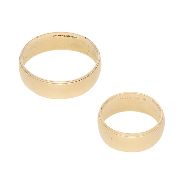 Dos argollas lisas en oro amarillo 14 kilates.