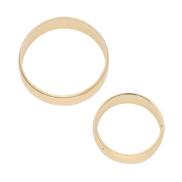 Dos argollas lisas en oro amarillo 14 kilates.
