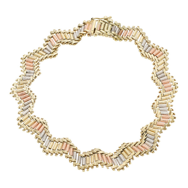 Pulsera eslabón boleado en oro tres tonos 14 kilates.