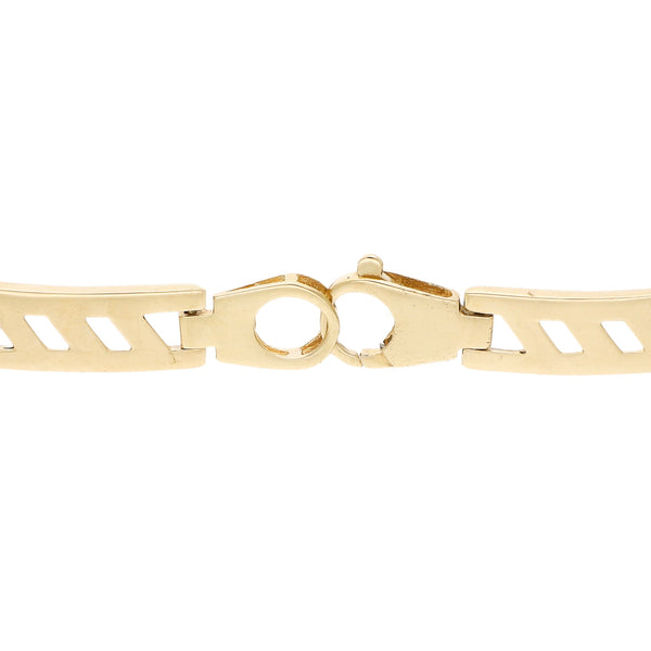 Pulsera eslabón articulado en oro dos tonos 14 kilates.