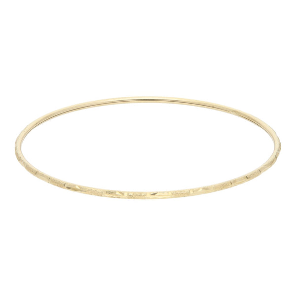 Pulsera de arillo labrada en oro amarillo 12 kilates.