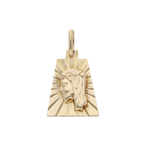 Medalla labrada motivo Divino Rostro en oro amarillo 14 kilates.
