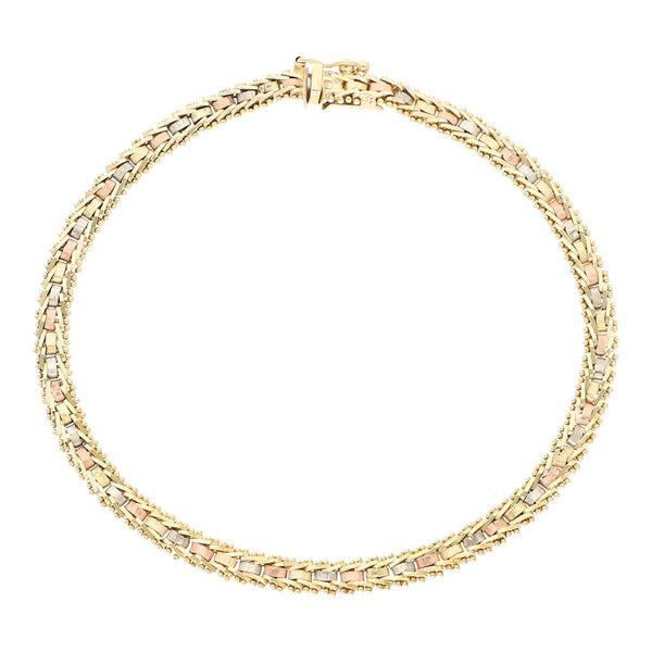 Pulsera eslabón boleado en oro tres tonos 14 kilates.
