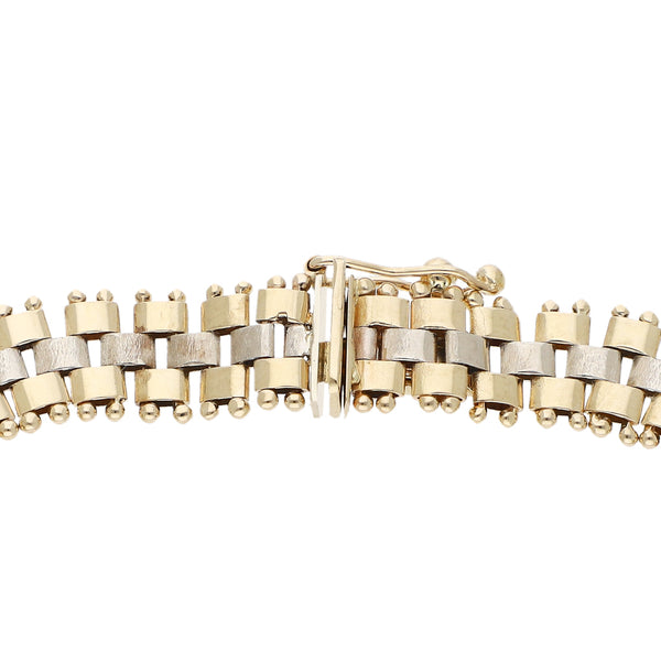 Pulsera eslabón articulado en oro dos tonos 14 kilates.