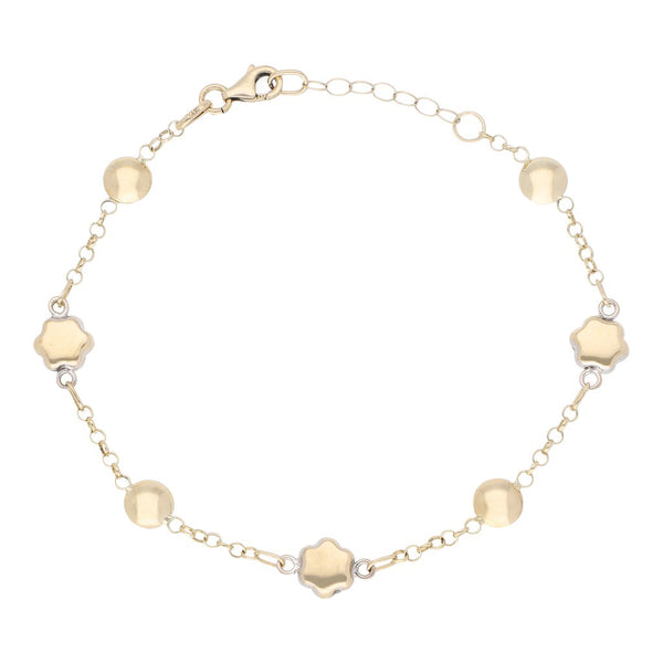 Pulsera eslabón cruzado con aplicaciones en oro amarillo 14 kilates.
