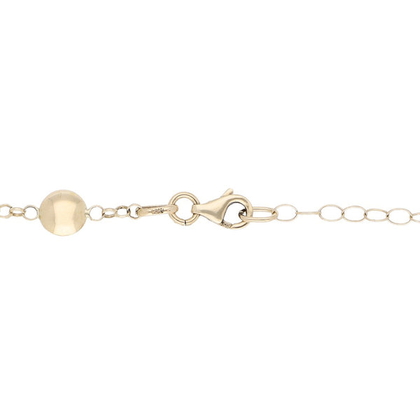 Pulsera eslabón cruzado con aplicaciones en oro amarillo 14 kilates.