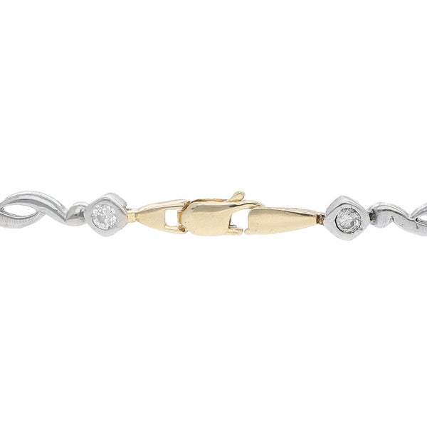 Pulsera eslabón articulado con sintéticos en oro dos tonos 14 kilates.