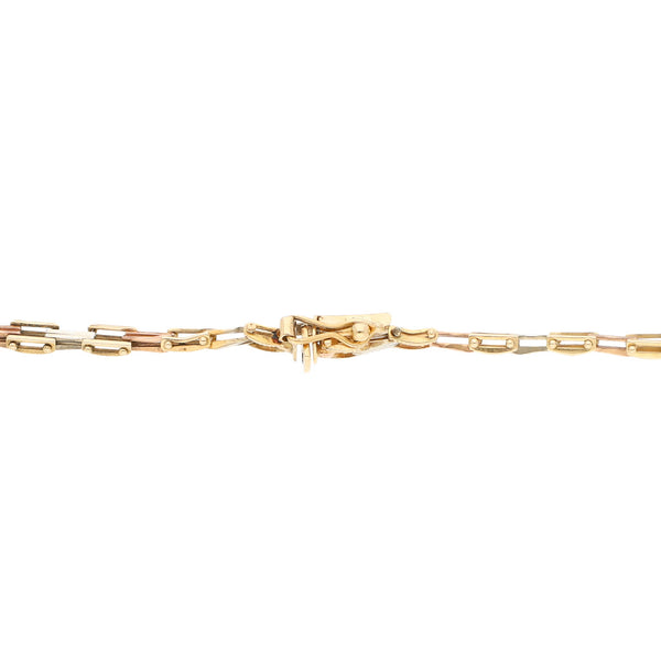 Pulsera eslabón articulado en oro tres tonos 14 kilates.