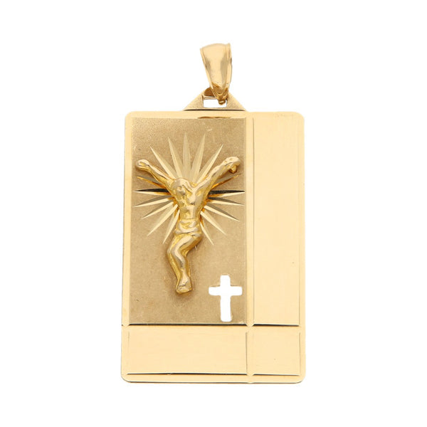 Medalla laminada motivo Cristo en oro amarillo 14 kilates.