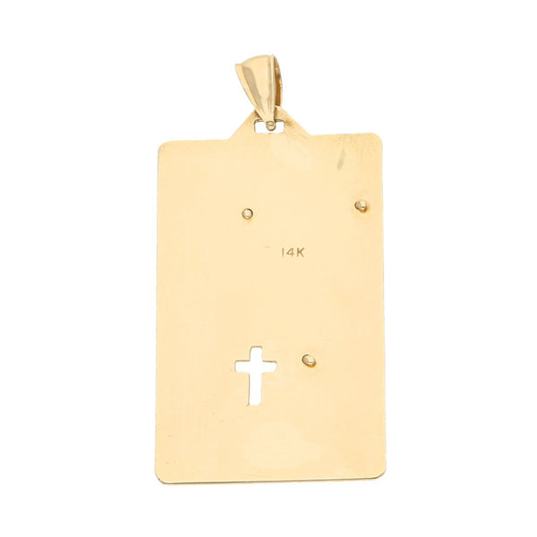 Medalla laminada motivo Cristo en oro amarillo 14 kilates.