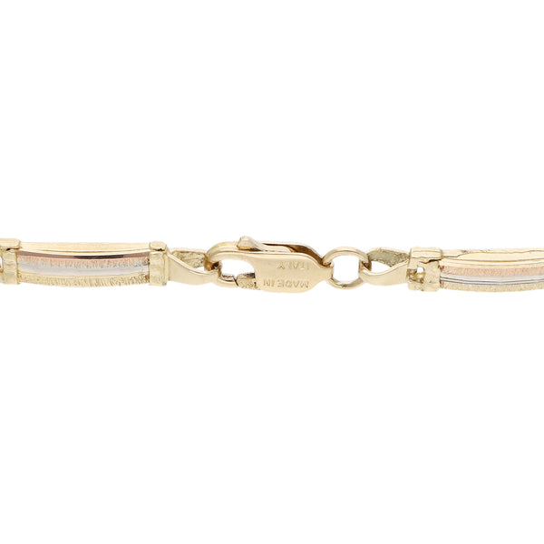 Pulsera eslabón articulado en oro dos tonos 14 kilates.