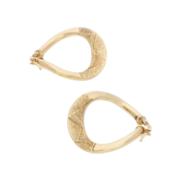 Arracadas onduladas en oro amarillo 14 kilates.