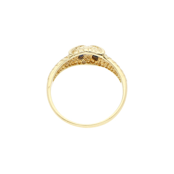 Anillo labrado motivo búho con sintéticos en oro amarillo 12 kilates.