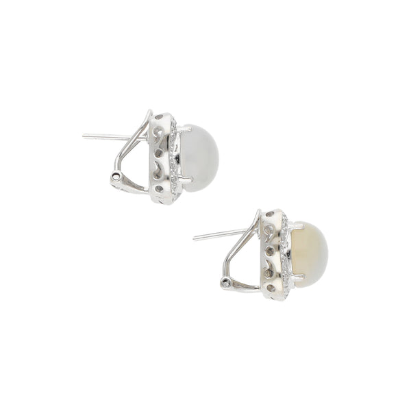 Aretes diseño especial con diamantes y sintéticos en oro blanco 14 kilates.